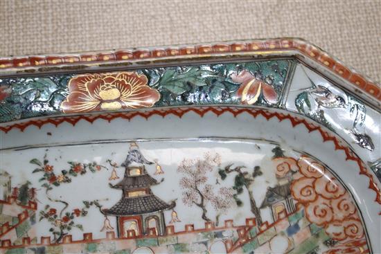 An 18th century Chinese famille verte octagonal meat plate, decorated with pagodas in a garden, flowers and birds, 36 x 26cm